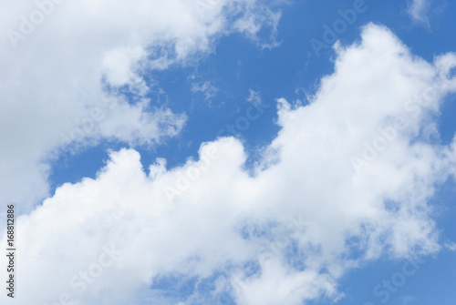 Blue sky with soft white clouds