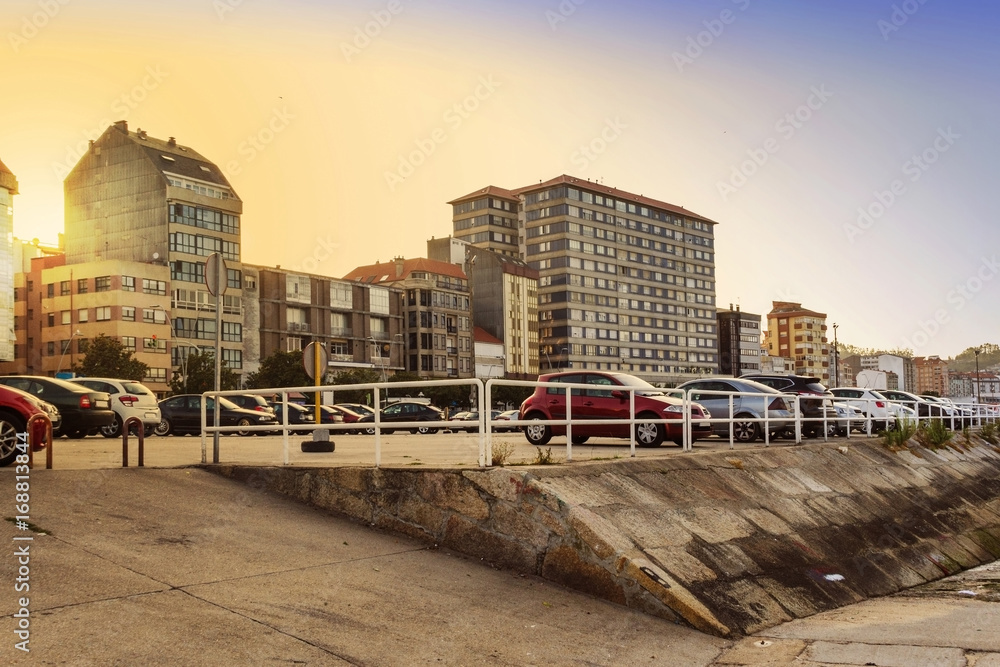 Buildings on the seafront at sunset