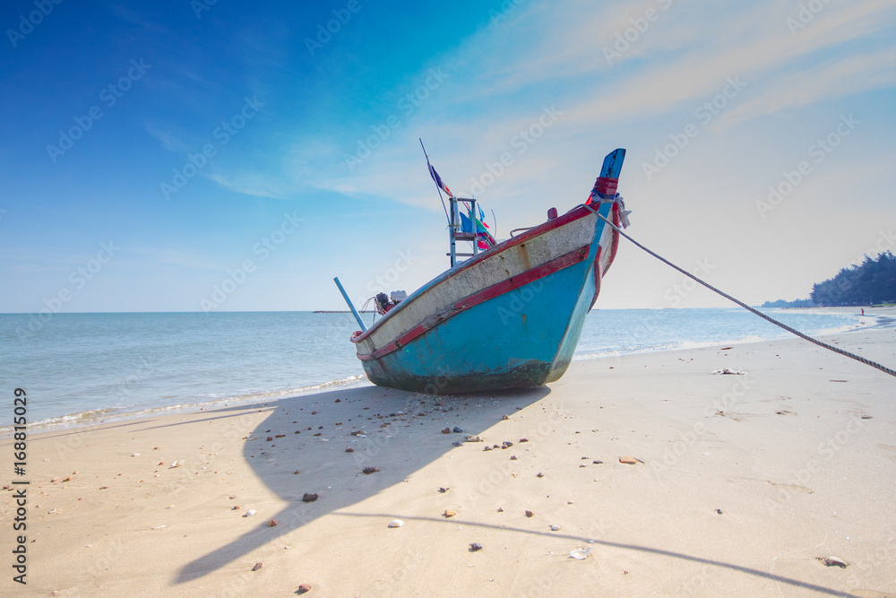 old wooden fishing boat Thailand beach with blue sky old wooden fishing boat Thailand beach with blue sky