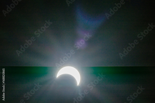 solar eclipse with glare backgrounds