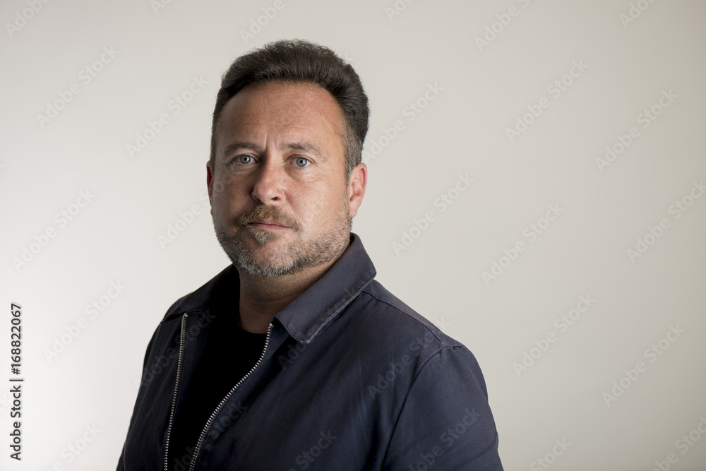 Man in Navy Blue Jacket Over Gray Background Copy Space Man in Navy Blue Jacket Over Gray Background Copy Space