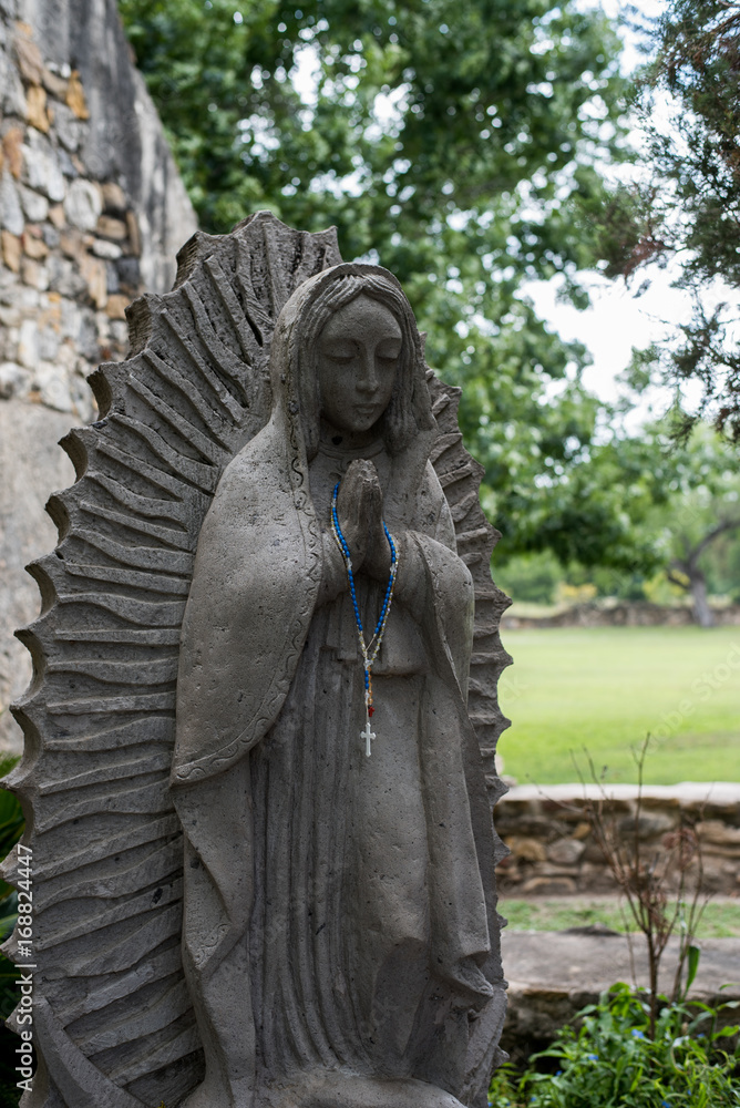 Statue of virgin mary with rosary beads Statue of virgin mary with rosary beads