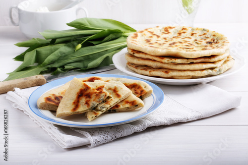 Khychiny – traditional caucasian flatbread filled with сheese and herbs.