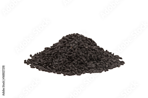 Black cumin seed in wooden scoop isolated on white background. Nigella sativa