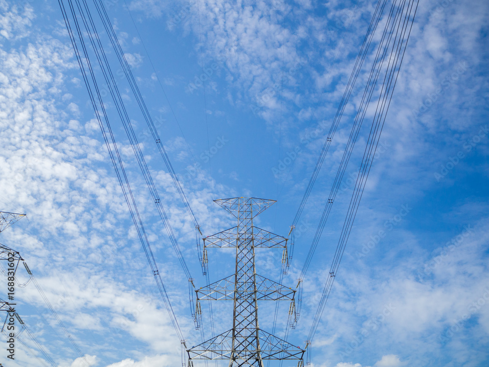 Steel electricity pylon on bright blue sky background. Steel electricity pylon on bright blue sky background.