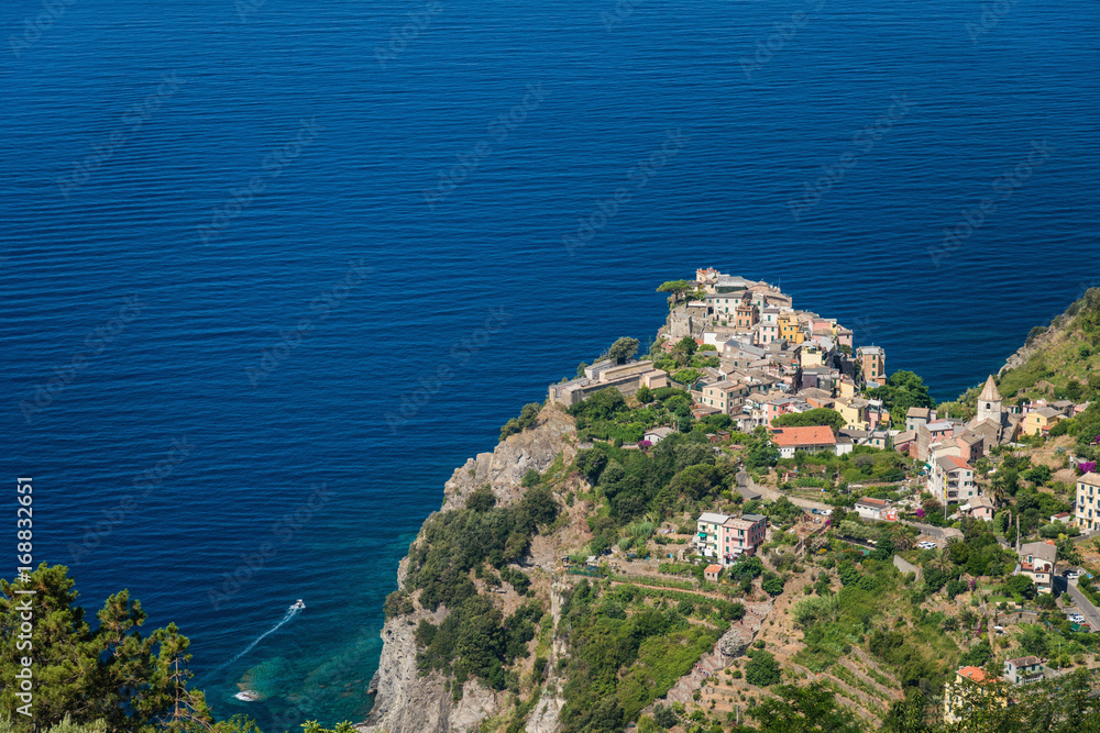 Small italian village on a cliff above sea
