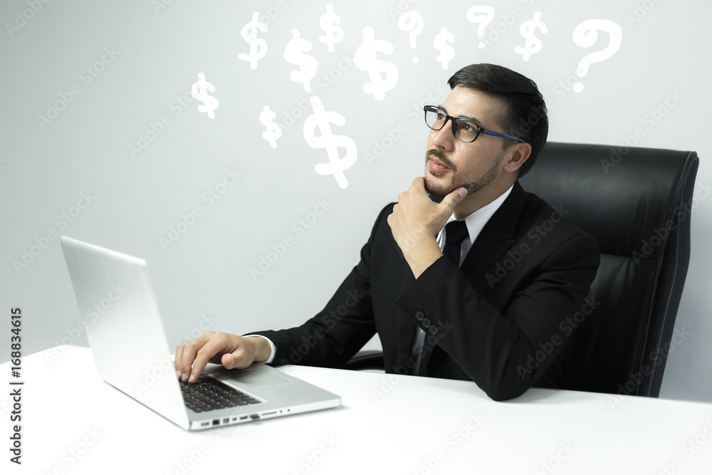 Young American businessman used to think of ways to make money. Young American businessman used to think of ways to make money.