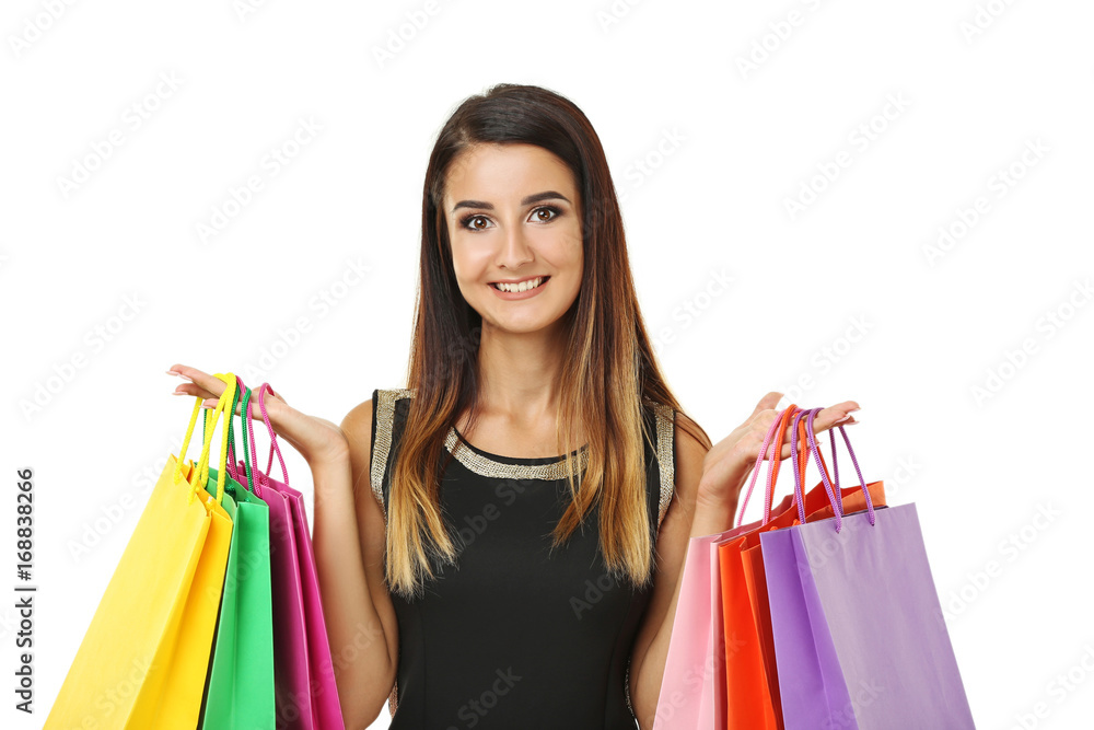 Portrait of young woman with shopping bags on white background Portrait of young woman with shopping bags on white background