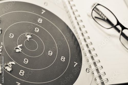 oal setting with target, objectives and planning concept, top view, You can make a great target of business like a bullet target photo