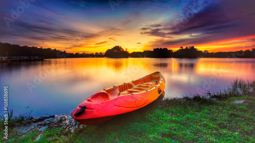 Amazing long exposure sunset view with dramatic sky and reflections at Wetland Lake Park, Putrajaya Malaysia. Nature composition.