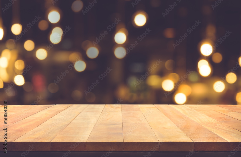 Empty of wood table top with blurred light gold bokeh abstract background.For montage product display or key visual layout Empty of wood table top with blurred light gold bokeh abstract background.For montage product display or key visual layout