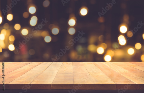 Empty of wood table top with blurred light gold bokeh abstract background.For montage product display or  key visual layout