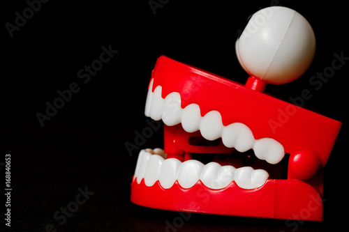 Fototapeta Chattering teeth toy from the side looking left mouth open