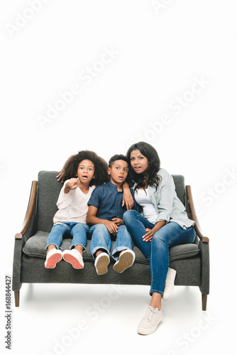 shocked mother with kids on sofa © LIGHTFIELD STUDIOS