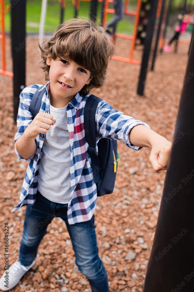 Obraz premium child boxing on playground