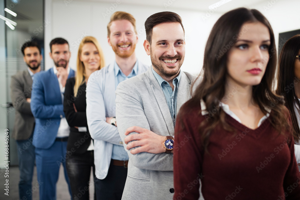 Team of cheerful businesspeople posing for group picture Team of cheerful businesspeople posing for group picture