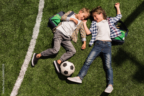 schoolboys with soccer ball