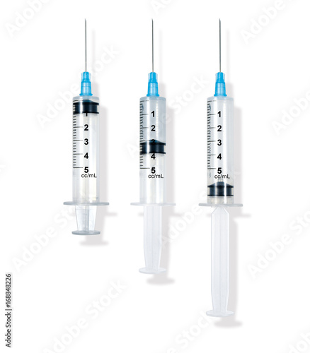 empty and full syringe isolated on white background with shadow