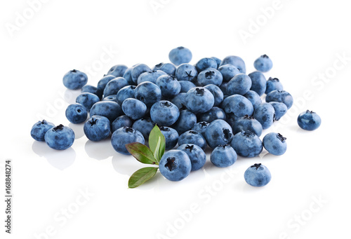 Healthy food. Close up view fresh ripe blueberry with leaves