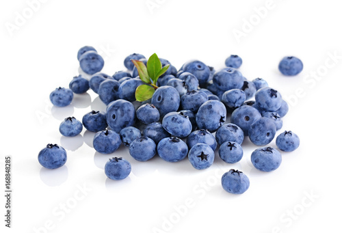 Healthy food. Close up view fresh ripe blueberry with leaves