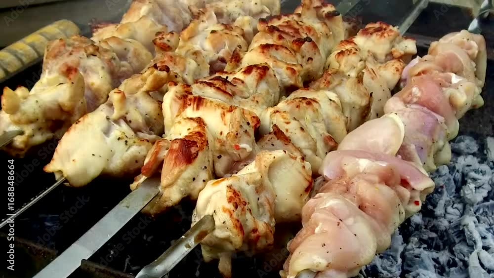 meat roasting on skewers in brazier outdoors meat roasting on skewers in brazier outdoors