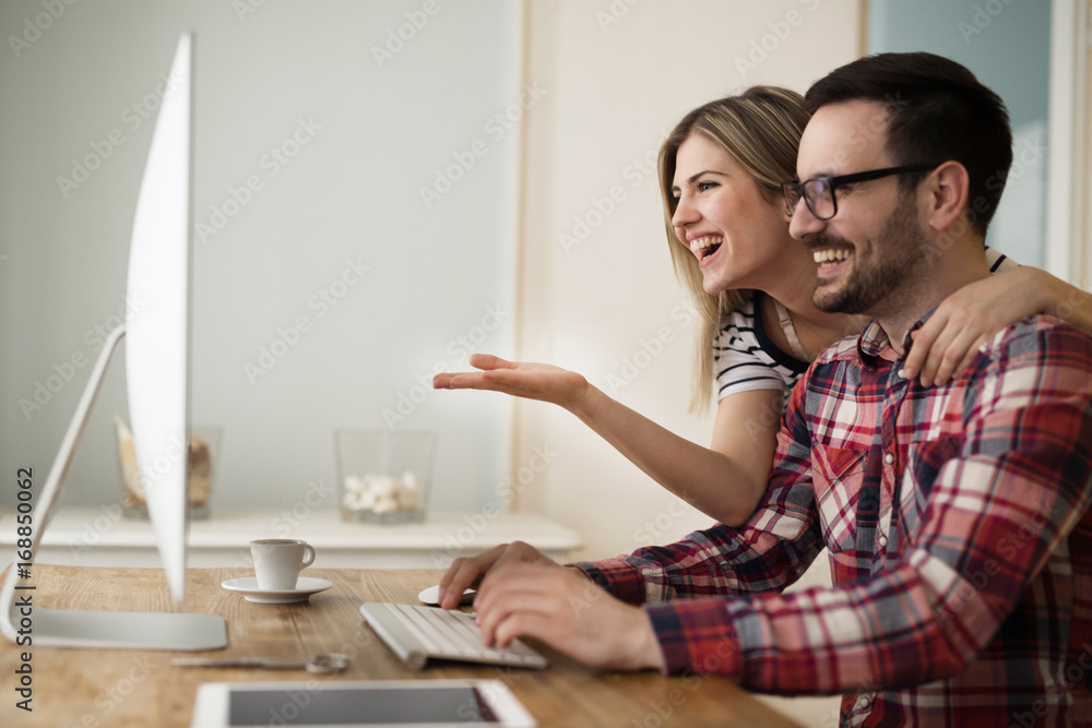 Beautiful woman and attractive man doing design work Beautiful woman and attractive man doing design work