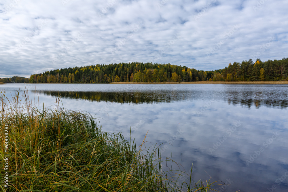 Autumn landscape with forest, lake and reflection, Finland, Saimaa