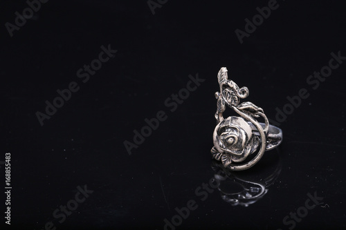rose ring,silver ring rose on black background