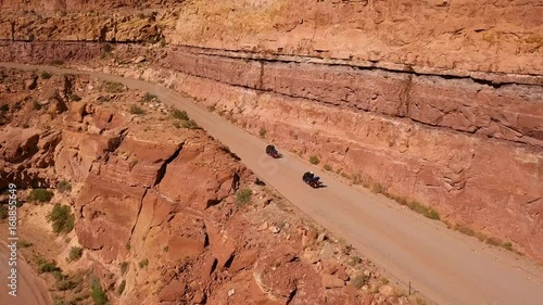 Motorcycle travelers on adventure in desert mountain