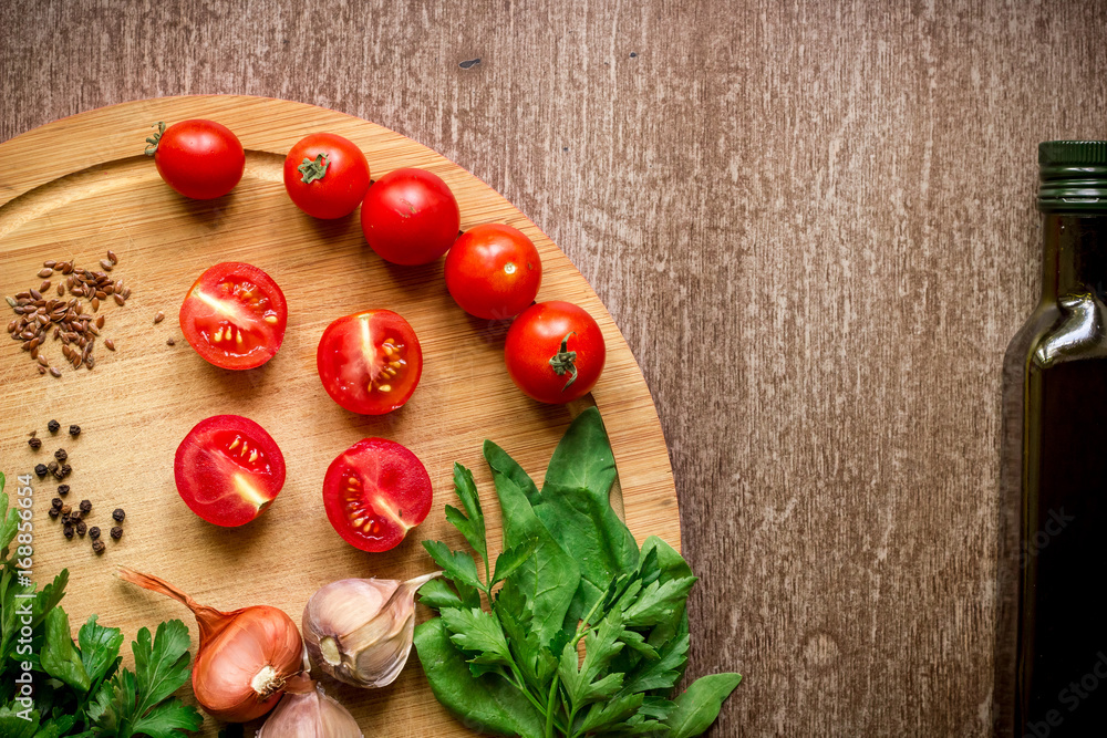 Fresh organic ingredients for salad making: spinach, tomatoes, sprouts, basil, olive oil on rustic background, top view. Fresh organic ingredients for salad making: spinach, tomatoes, sprouts, basil, olive oil on rustic background, top view.