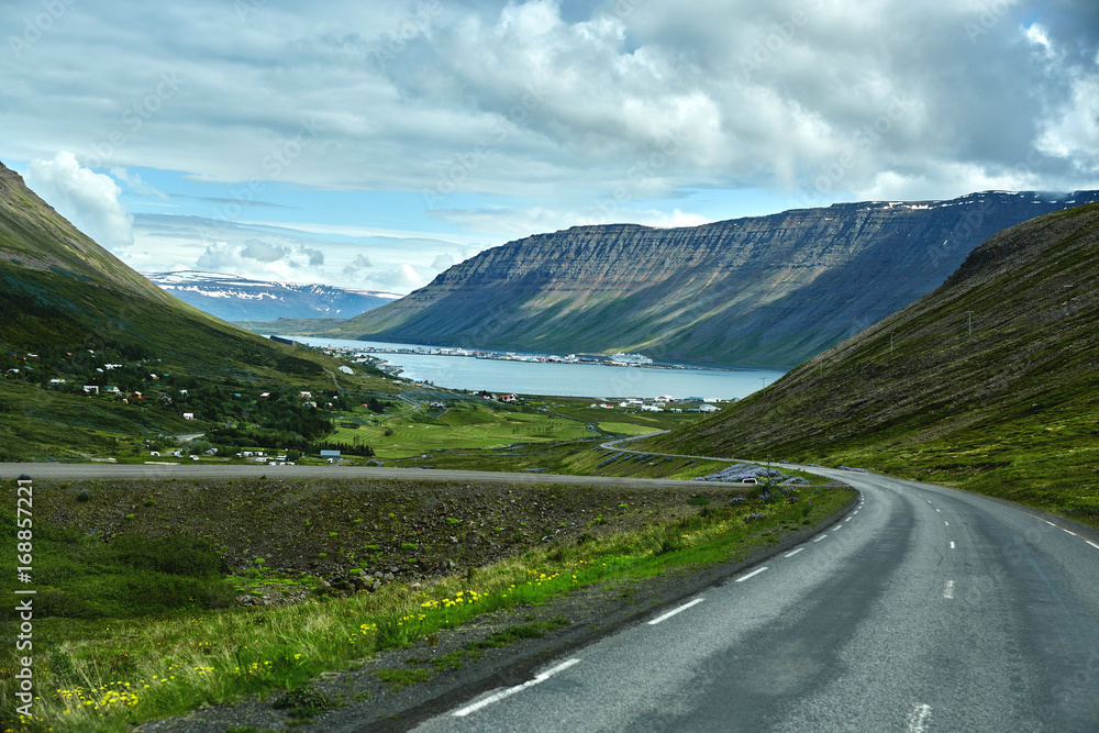 Travel to Iceland. A mountain road to the town of Isafjordur and a view of the fjord
