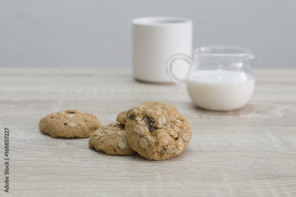 COOKIES AND COFFEE MUG
Oat meal raisin cookies and coffee with milk on the wood table. COOKIES AND COFFEE MUG
Oat meal raisin cookies and coffee with milk on the wood table.