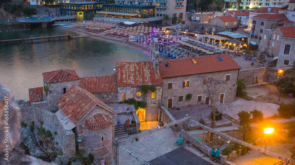 Fototapeta premium Narrow streets of the old evening Budva in Montenegro