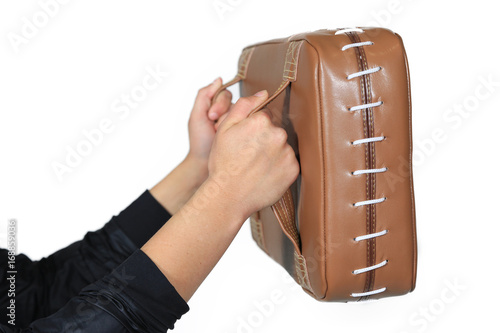 Female hands holding a shield of martial arts
