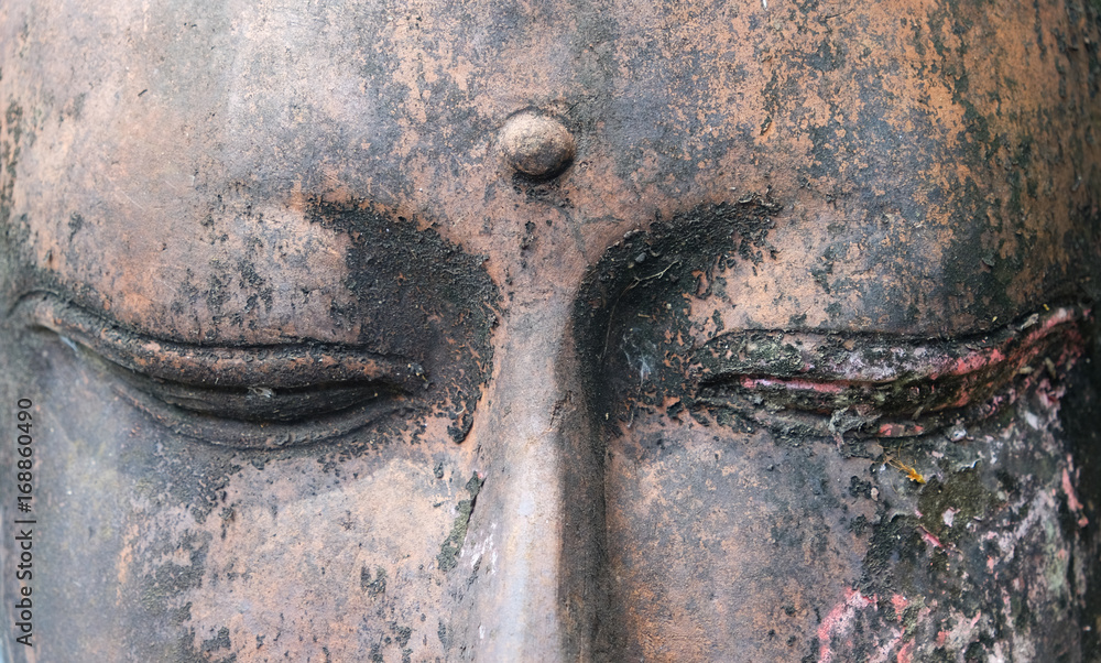 old buddha sculpture with closed eyes, close up Stock Photo Adobe Stock