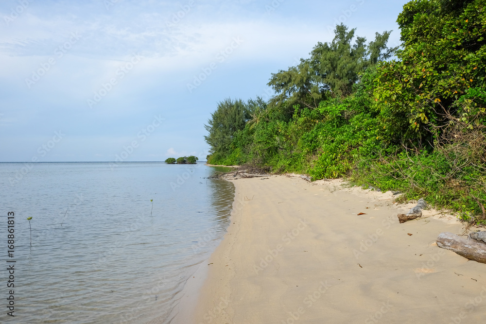 uninhabitated tropical island shore with white sand  close to Karimunjawa