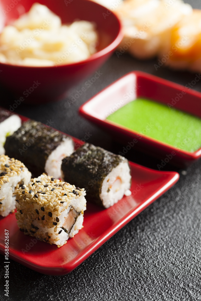 Sushi food on red plate and wasabi