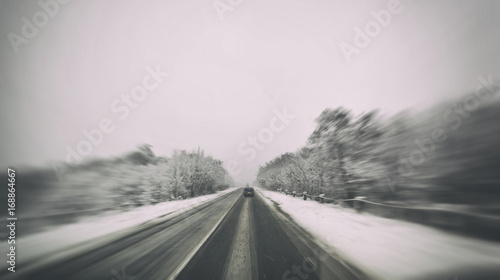 Blured winter asphalt road