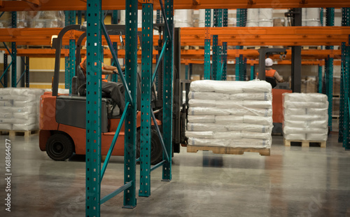A big warehouse with forklift.