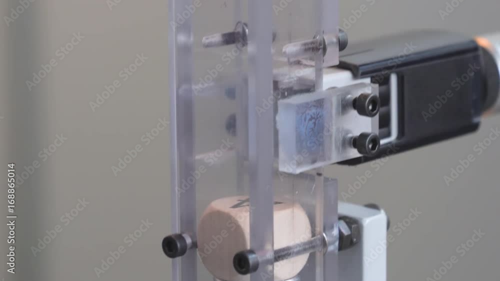 Printing on white model object, slow motion, closeup. Printing technology. Automatic printer Printing on white model object, slow motion, closeup. Printing technology. Automatic printer