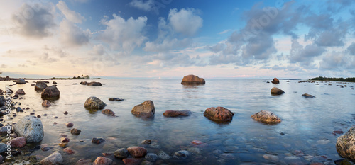 Fototapeta Naklejka Na Ścianę i Meble -  Rocky shores at the sea in sunset light. Lahemaa natural park coastal landscape with beautiful sky