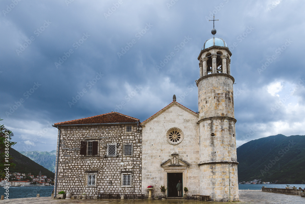 Roman Catholic Church Of Our Lady Of The Rocks  on Our Lady Of The Rocks island. One of the two islets near coast of Perast town at Kotor bay. Gospa Od Skrpeja - tourist attraction in Montenegro.