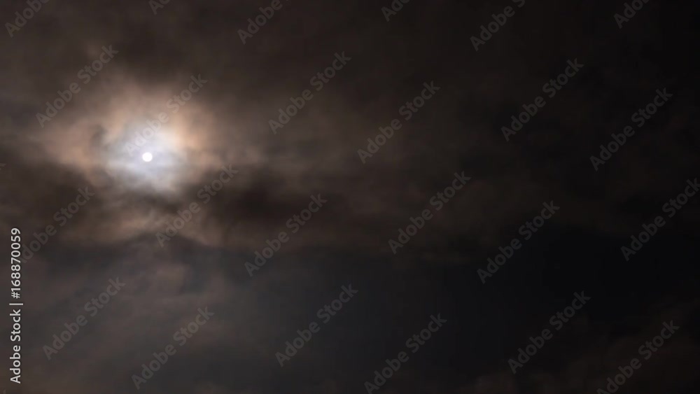 The moon is visible and hiding behind black clouds. Night for vampires. Time-lapse video. The moon is visible and hiding behind black clouds. Night for vampires. Time-lapse video.