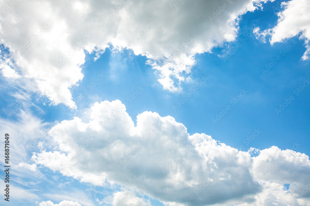 Obraz premium White fluffy clouds in the blue sky
