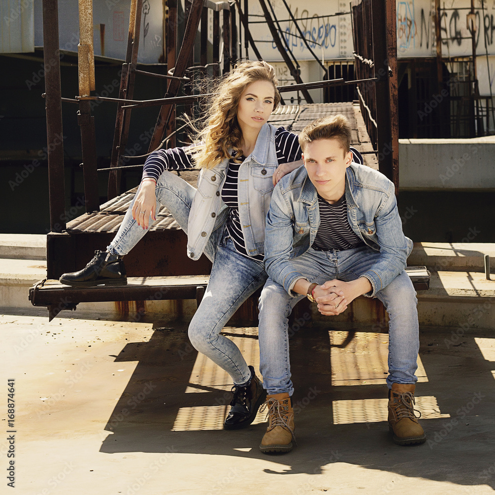 Young beautiful fashion couple wearing jeans clothes in daylight. Love  concept. Photos | Adobe Stock
