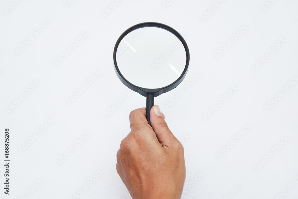 Hand Holding Magnifying Glass Over White Background Hand Holding Magnifying Glass Over White Background