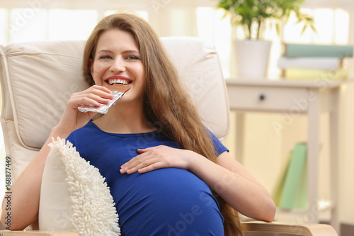 Emotional pregnant woman si...