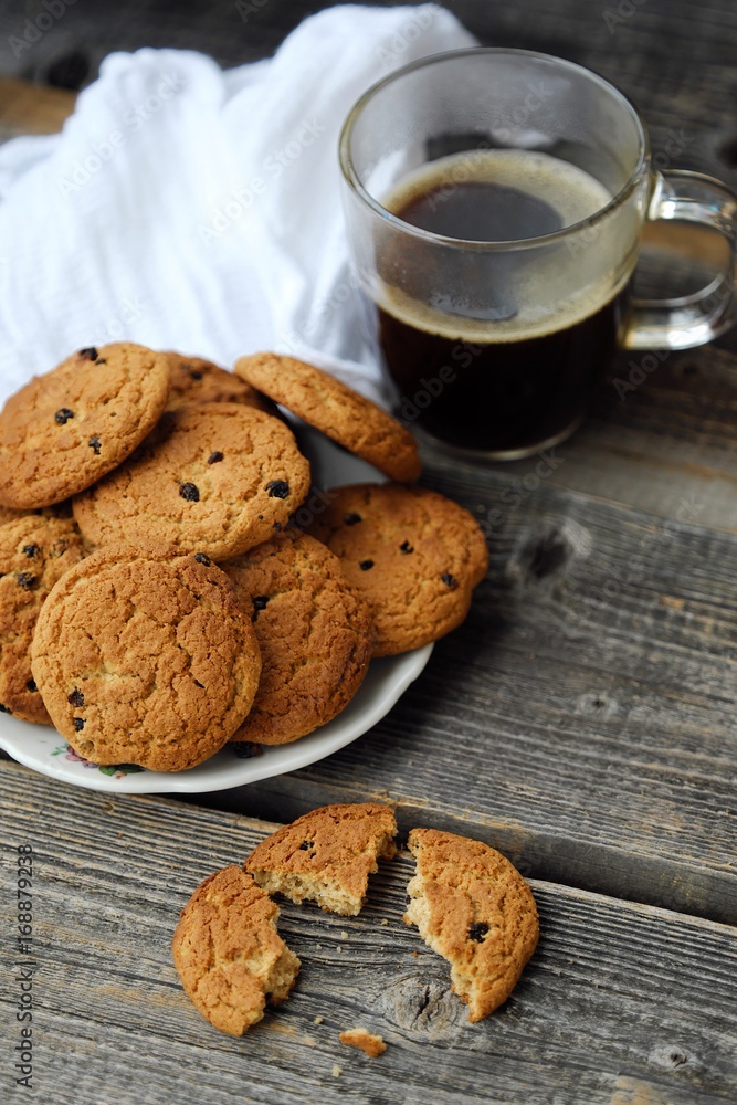 Homemade oatmeal cookies with raisins and coffee Homemade oatmeal cookies with raisins and coffee