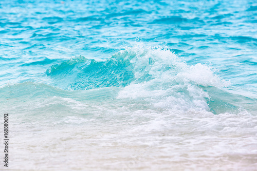 Sea waves on beach at resort