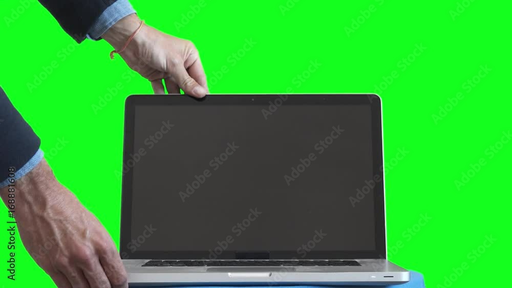 Businessman Opens Green Screen Laptop. Male hands opening a green ...